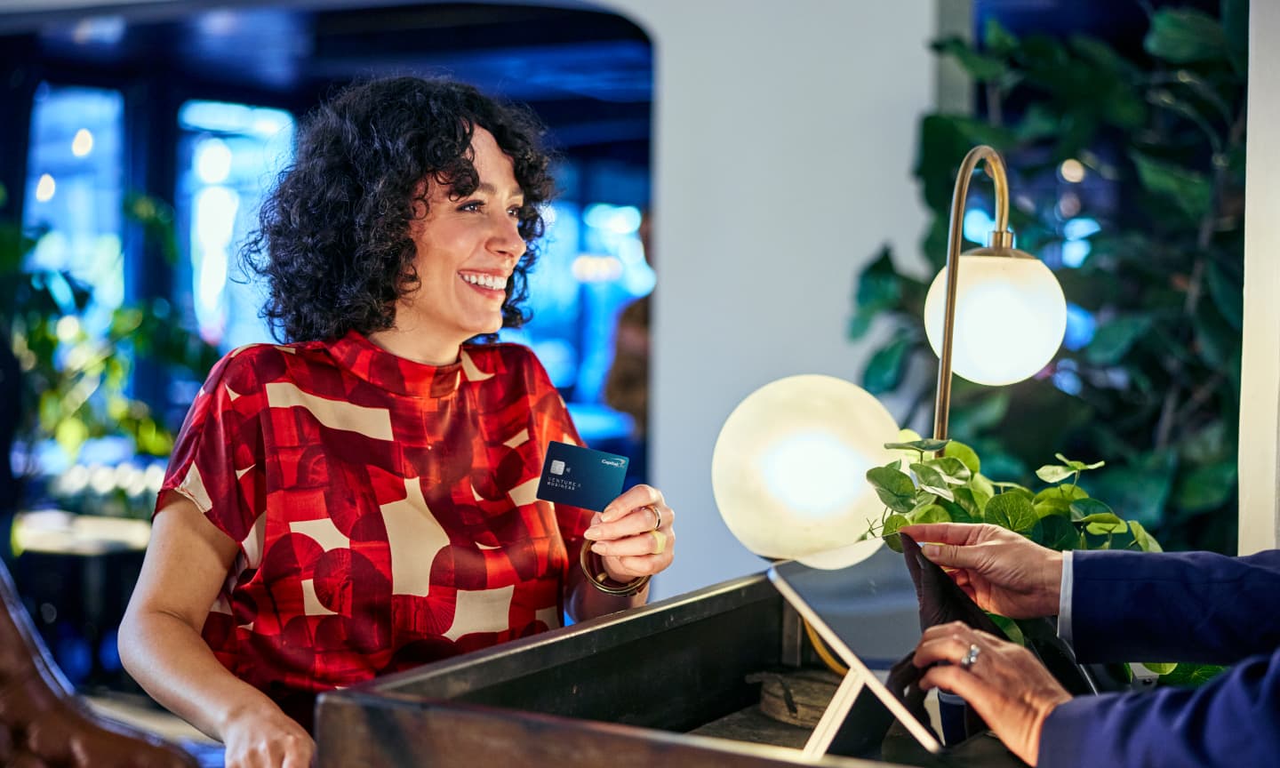 woman using capital one card