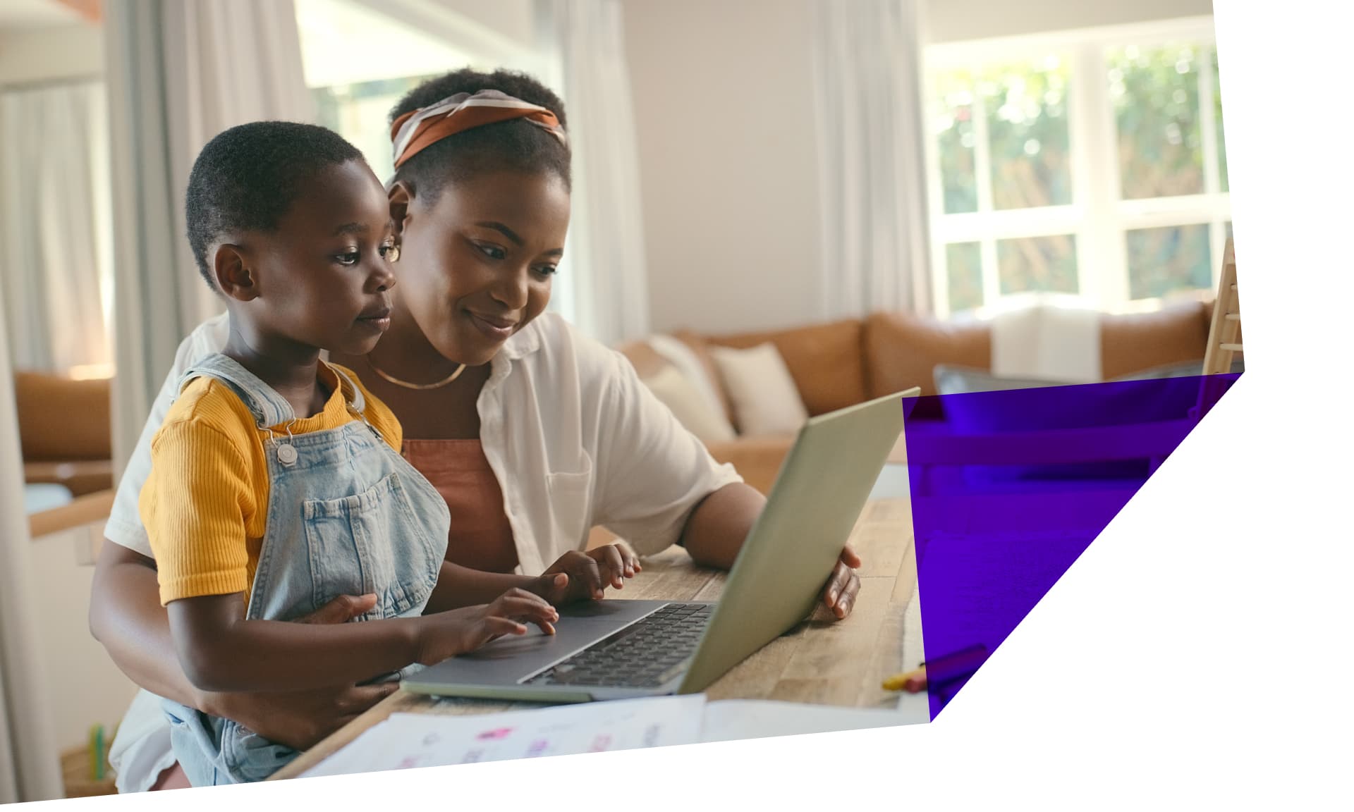 mother and young son at computer together stock image