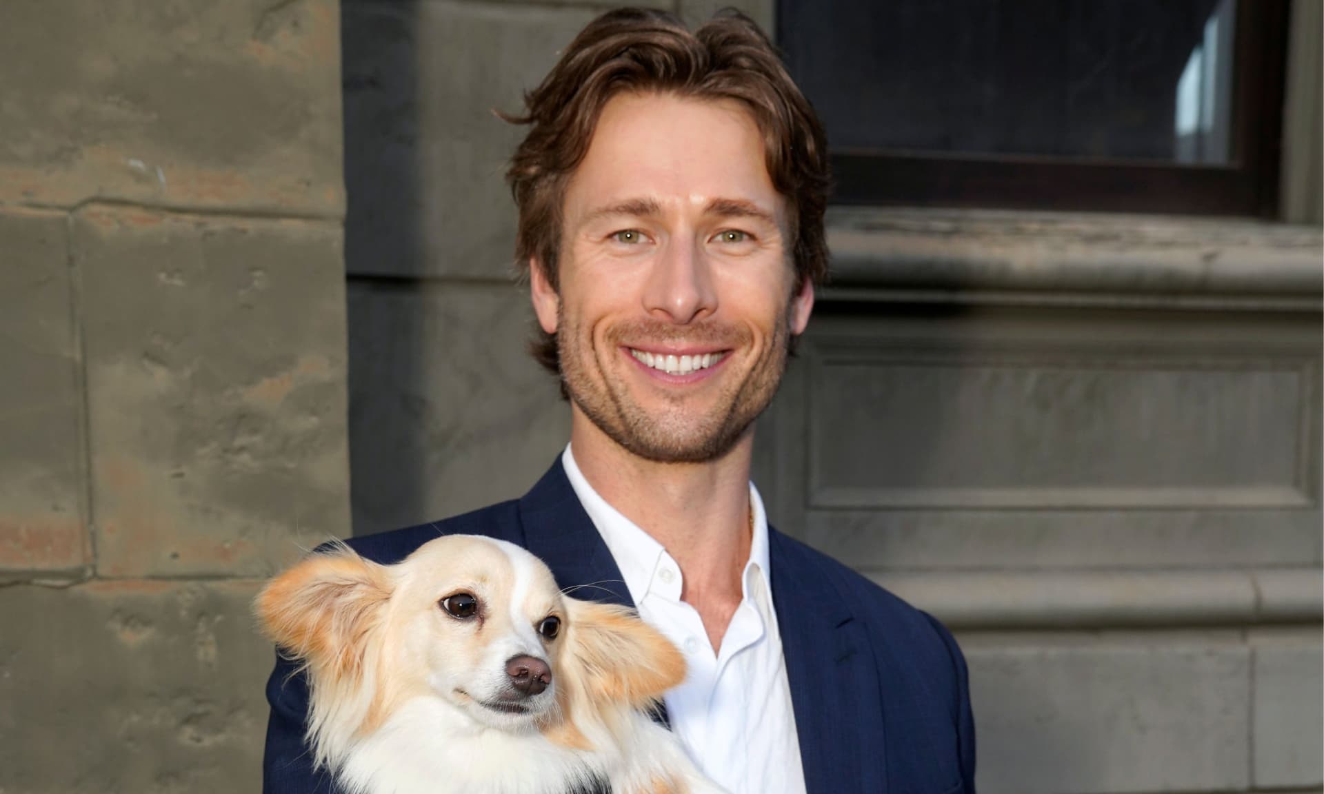 Glen Powell and Brisket the dog