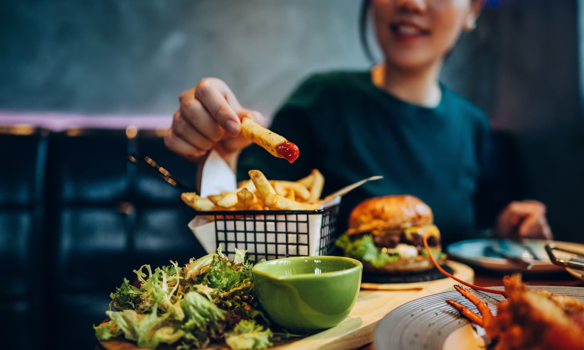A woman eating at a restaurant