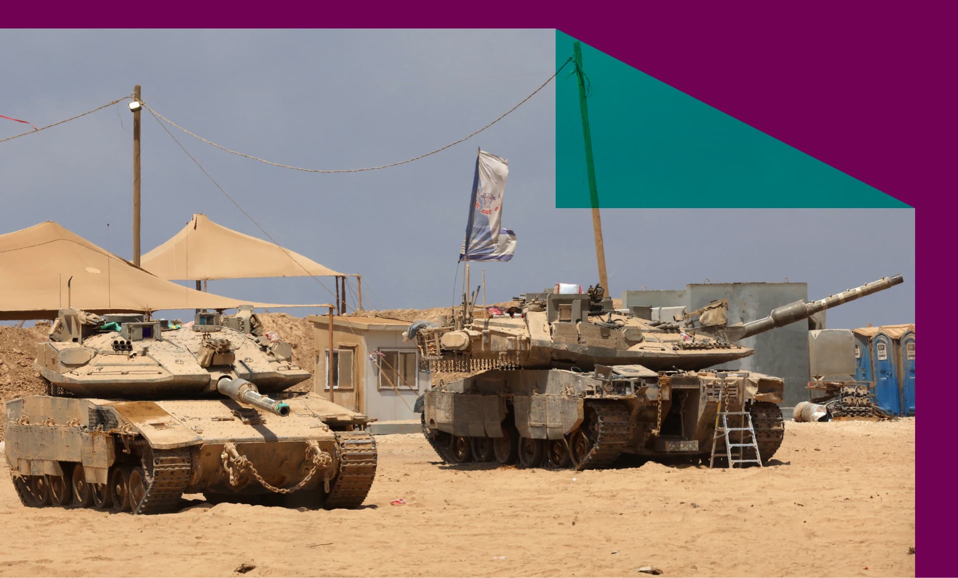 Israeli military vehicles are positioned along the border with the Gaza Strip on August 21, 2025