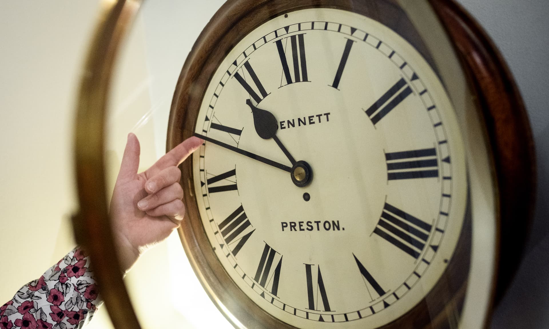 Someone changing the clock