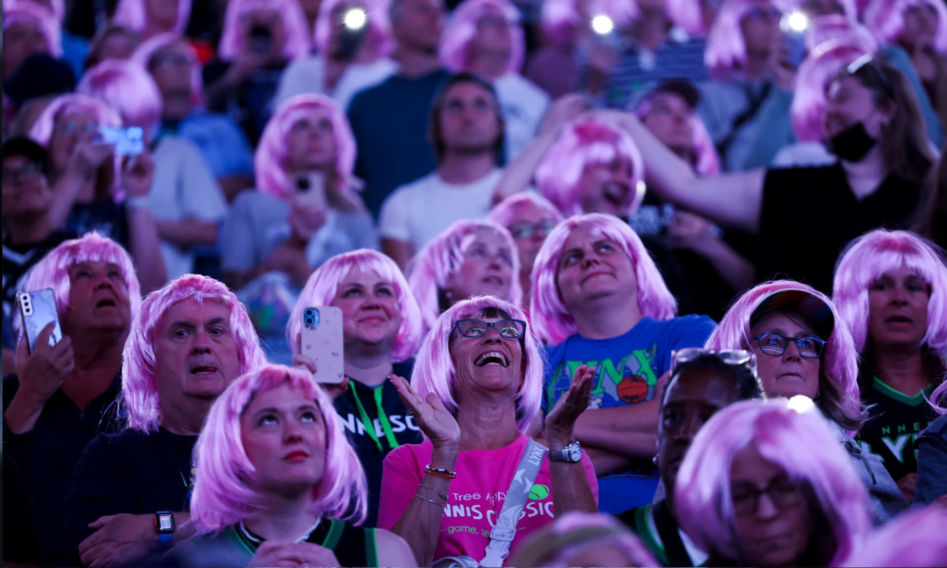Minnesota Lynx fans wear pink wigs in the crowd during the first quarter against the Golden State Valkyries