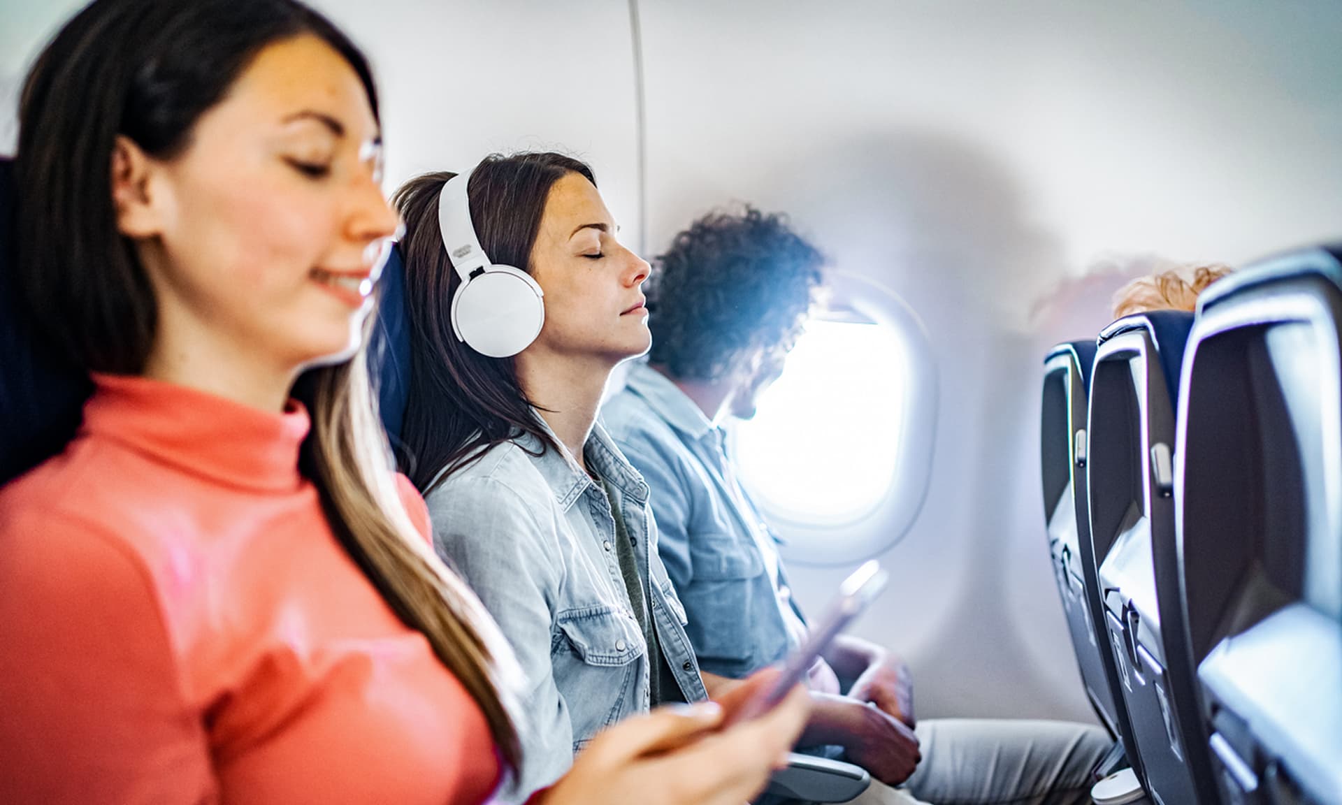 Woman stuck in middle seat on a flight